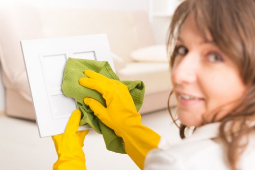 Professional domestic cleaner working in an Enfield kitchen